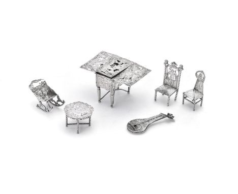 Continental silver toys: furniture, comprising a novelty box, import marked for London 1891, in the form of a drop flap table