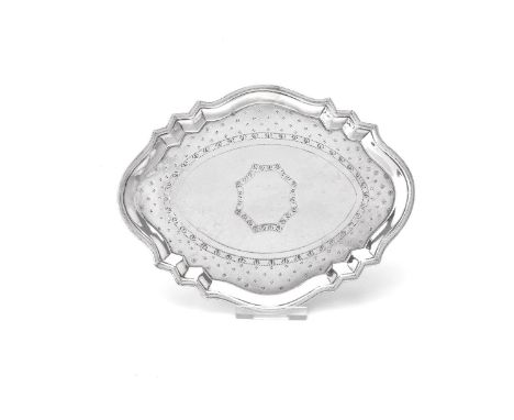 A George III silver commode shape tea pot stand by Robert Hennell I, London 1792, with a raised dot engraved rim and bright-c
