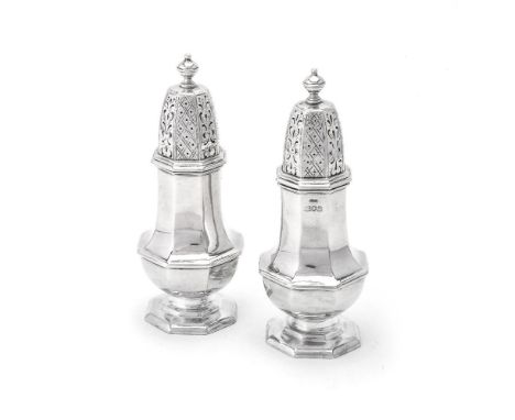 A matched pair of silver octagonal baluster sugar casters by Stokes &amp; Ireland Ltd, London 1911 and 1912, with turned ball