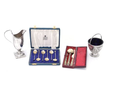 A collection of small silver, comprising: a George III circular pedestal sugar basket, maker's mark worn, London 1808, with a