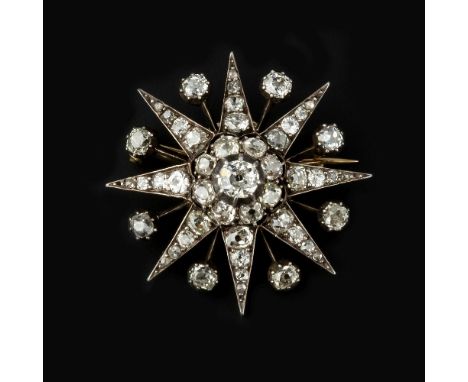 A late Victorian diamond star brooch, circa 1880, the gold backed silver star shaped panel set with old mine cut diamonds, wi