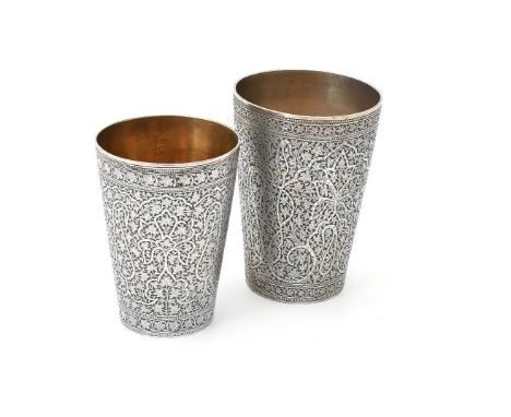 Two Indian silver tapered beakers, one marked Hamilton &amp; Co., Calcutta, one engraved H.J.B. Septr. 8. 1881, each chased w