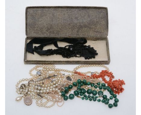 ϒA small collection of costume jewellery, to include a graduated malachite bead necklace; a French jet and velvet ribbon chok