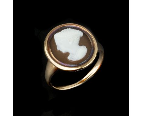 A Victorian hardstone cameo ring, circa 1860, the oval panel carved with a lady's profile with intricately woven hair, within