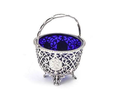 A Victorian silver circular sugar basket by George John Richards &amp; Edward Charles Brown, London 1865, with a pierced swin