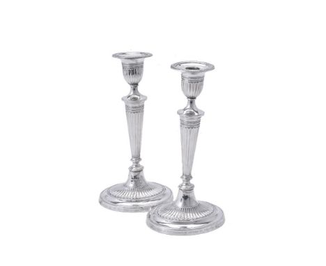 A matched pair of silver oval candlesticks by Fordham &amp; Fordham, Sheffield 1915 and 1918, with detachable sconces, fluted