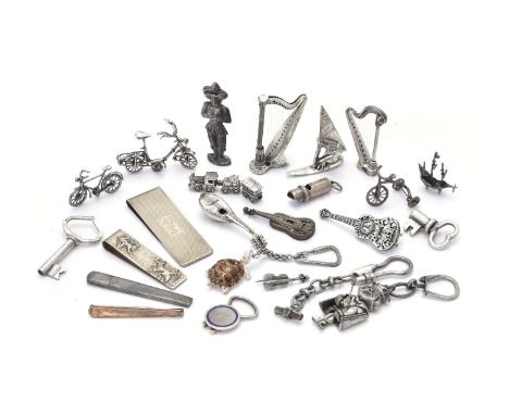 A collection of small silver coloured, white alloy and plated objects, including: model musical instruments, two bicycles, ke