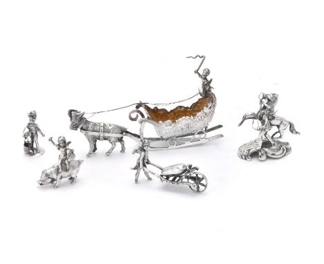 Five Continental silver toys with cherubs: driving a goat drawn sleigh, import marked for London 1903, sponsor's mark of Faud