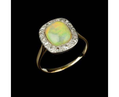 An opal and diamond cluster ring, the oval cabochon opal within a surround of rose cut diamonds, approximately 0.21 carats to