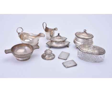 A small collection of silver items, comprising: a navette shaped inkwell by Garrard &amp; Co., London 1921, with a bud finial