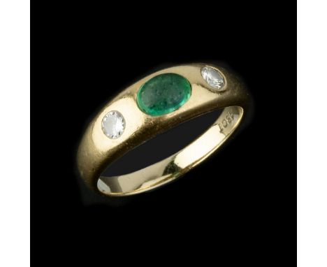 A three stone diamond and emerald ring, the central oval cabochon emerald flanked by two brilliant cut diamonds, approximatel