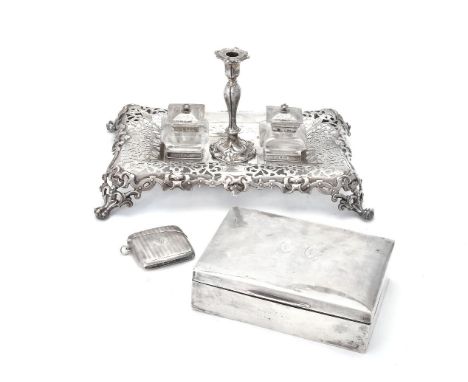 A Victorian silver shaped rectangular inkstand by Henry Wilkinson &amp; Co., Sheffield 1848, with a detachable taperstick, tw