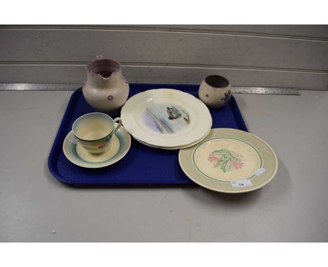 Mixed Lot: Poole Pottery jug and vase, a Newport Pottery cup and saucer in the Clarice Cliff style, further decorated bird pl