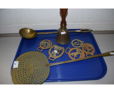 Mixed Lot: Various brass wares comprising a cream skimmer, ladle, horse brasses and a small bell