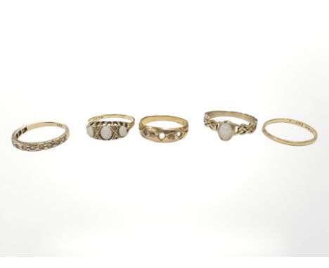 Five yellow gold antique and later dress rings, two set with opals. CONDITION REPORT: 18ct opal ring 2.9g. 18ct ring (Af) 2.5