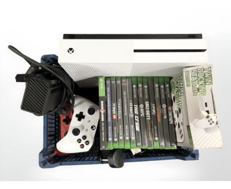 An Xbox One console, controllers and various games. (1 box)