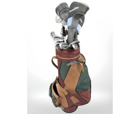 A golf bag containing assorted irons and drivers including Yamato, Delta, Arrow, etc. 