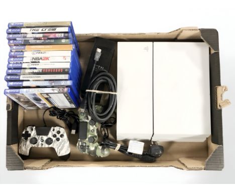 A Playstation 4 console, controllers and various games. (1 box)