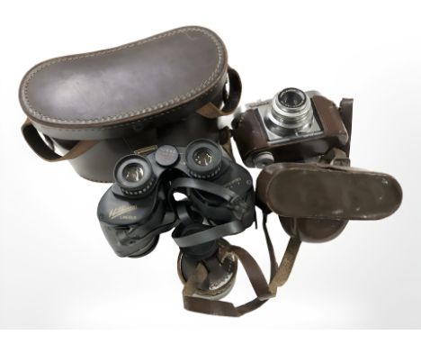 A pair of Wilkinson 10x40 binoculars and a Voigtlander Vito B camera.