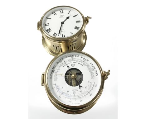A Schatz brass ships style barometer and a further quartz timepiece. 