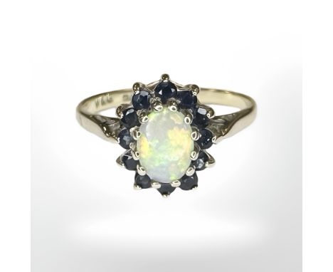 A 9ct yellow gold cluster ring set with synthetic opal and sapphire, size N/O CONDITION REPORT: 2.5g.