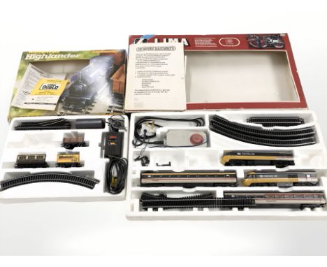 A Lima OO gauge train set and a further Hornby Highlander train set.