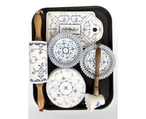 A group of Danish blue and white wall plates, pierced dishes, further matching rolling pin, etc. 