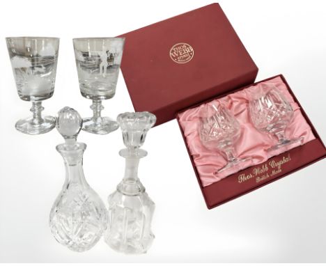 A boxed pair of Thomas Webb crystal brandy balloons, two further footed glasses etched with hunting scenes, and two decanters
