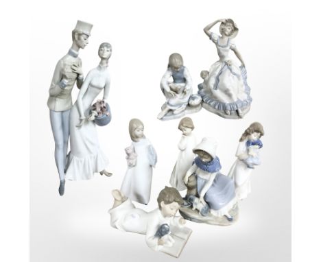 A large Lladro figure group of a lady and gentleman, height 44 cm, five various Nao figures and two further unmarked Spanish 