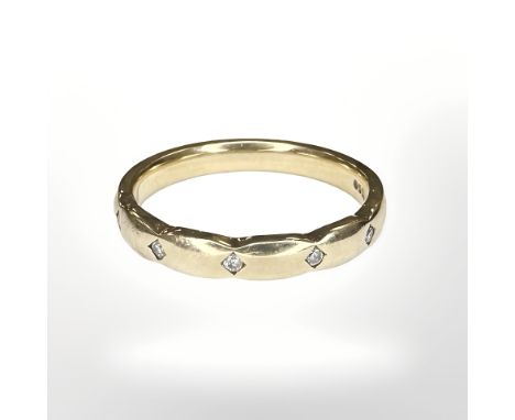 A 9ct yellow gold band ring set with diamonds, size M/N CONDITION REPORT: 2.7g.