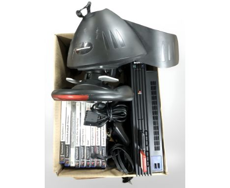 A Playstation 2 console, controllers and various games. (1 box)