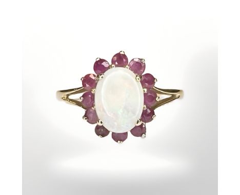 A 9ct yellow gold synthetic white opal cluster ring size L/M. CONDITION REPORT: 1.7g.