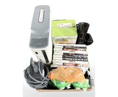 An Xbox 360 console, with controllers, various games and Guitar Hero game.
