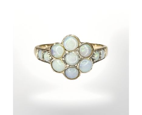 A 9ct yellow gold opal cluster ring, size O. CONDITION REPORT: 2.8g.