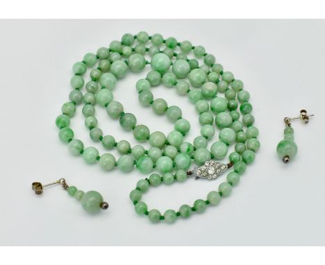 A Chinese Jade bead necklace and earrings suite. The necklace strung with graduated jade beads united by paste set clasp with