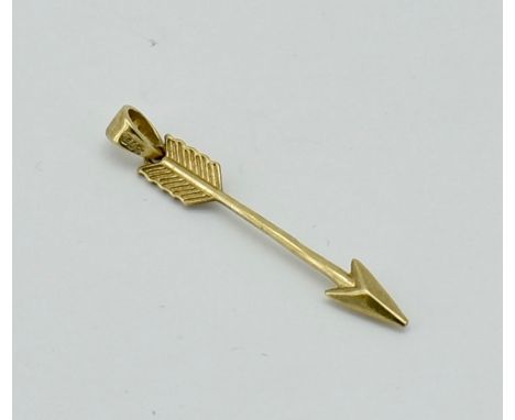 A 9ct gold cupids arrow charm. The charm / pendant in the form of an arrow with bale atop marked 9ct. Total weight / Measures