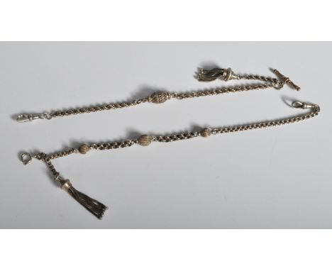 2 believed Victorian silver Albertina chains. Each of decorative form with ball spacers to one having tassled ends and lobste