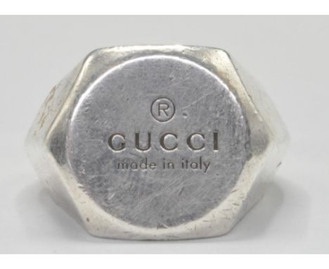 A silver Gucci ring of Large form with hexagonal head. Engraved Gucci made in Italy. Marked 925 to the inside and stamped 169