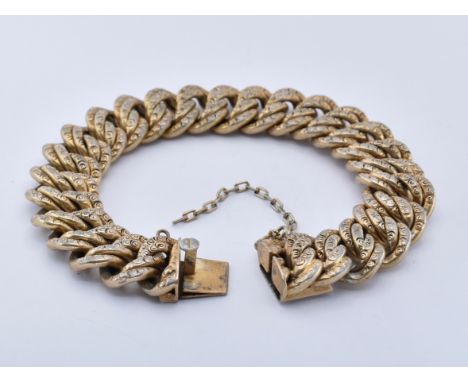 An antique silver gilt&nbsp;gourmette bracelet. The bracelet formed of double entwined links having scrolled decoration and u