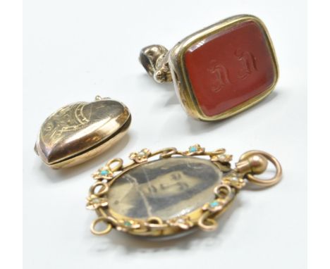 A group of gold plated items to include a gold plated seal fob set with a red stone panel engraved with initials, an edwardia