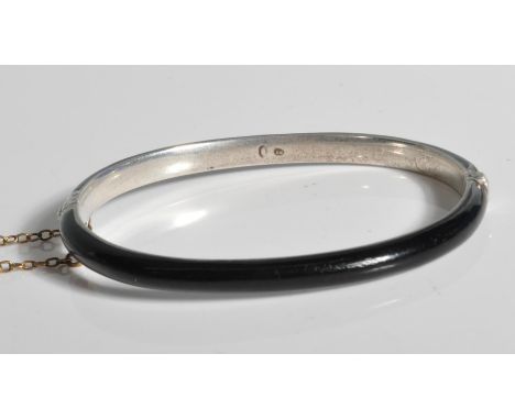 An antique silver and black enamel mourning bangle / bracelet. Complete with attached safety chain. Total weight 11.9g / Meas