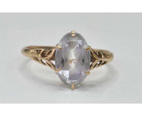 An early 20th century 9ct gold and rock crystal single stone ring. The ring with white marquise cut rock crystal within pierc