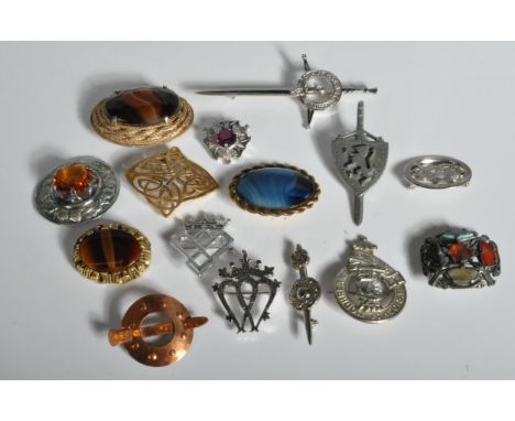 A group of fifteen various vintage 20th Century Scottish style brooches to include a celtic knot brooch, Scottish thistle bro