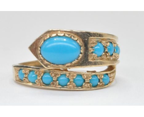 A 9ct gold and turquoise set snake / serpent ring. The ring of coiled form with turquoise set body and snakes head. London ha