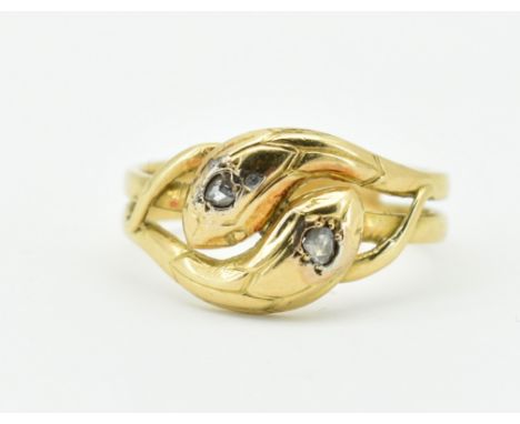 A French Art Nouveau 18ct gold and diamond snake ring. The ring formed two entwined snakes having diamond set eyes. French ea