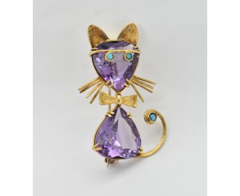 An 18ct gold amethyst and turquoise brooch in the form of a cat. The cat having heart cut amethyst head and body with turquoi