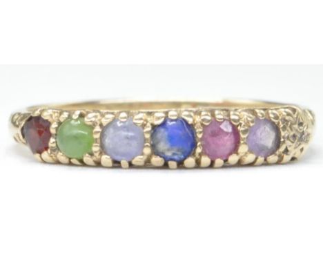 A hallmarked 9ct gold ring set with six coloured gemstone cabochons with scrolled shoulders. Hallmarked London 1989. Weight 1