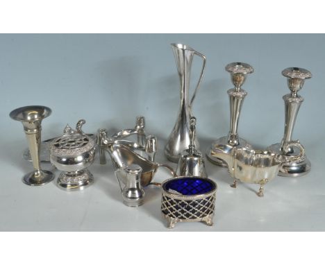 A good quantity of vintage 20th century silver plate comprising of candlesticks, gravy boats, bon bon dishes, a jug and more.