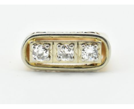 A French 18ct gold, platinum and diamond three stone ring. The ring set with three round brilliant cut diamonds. Estimated di