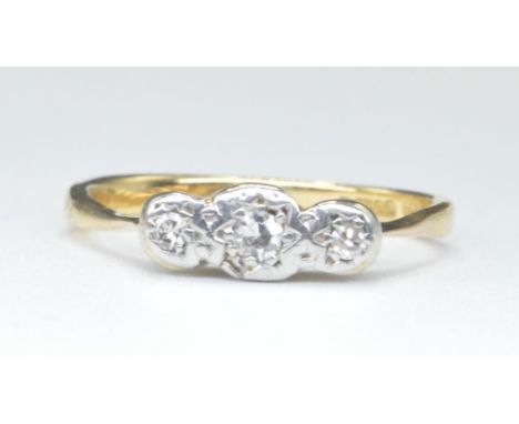 A 9ct gold and diamond 3 stone ring. Hallmarked London with three illusion set diamonds to plain tapering shank. Total weight